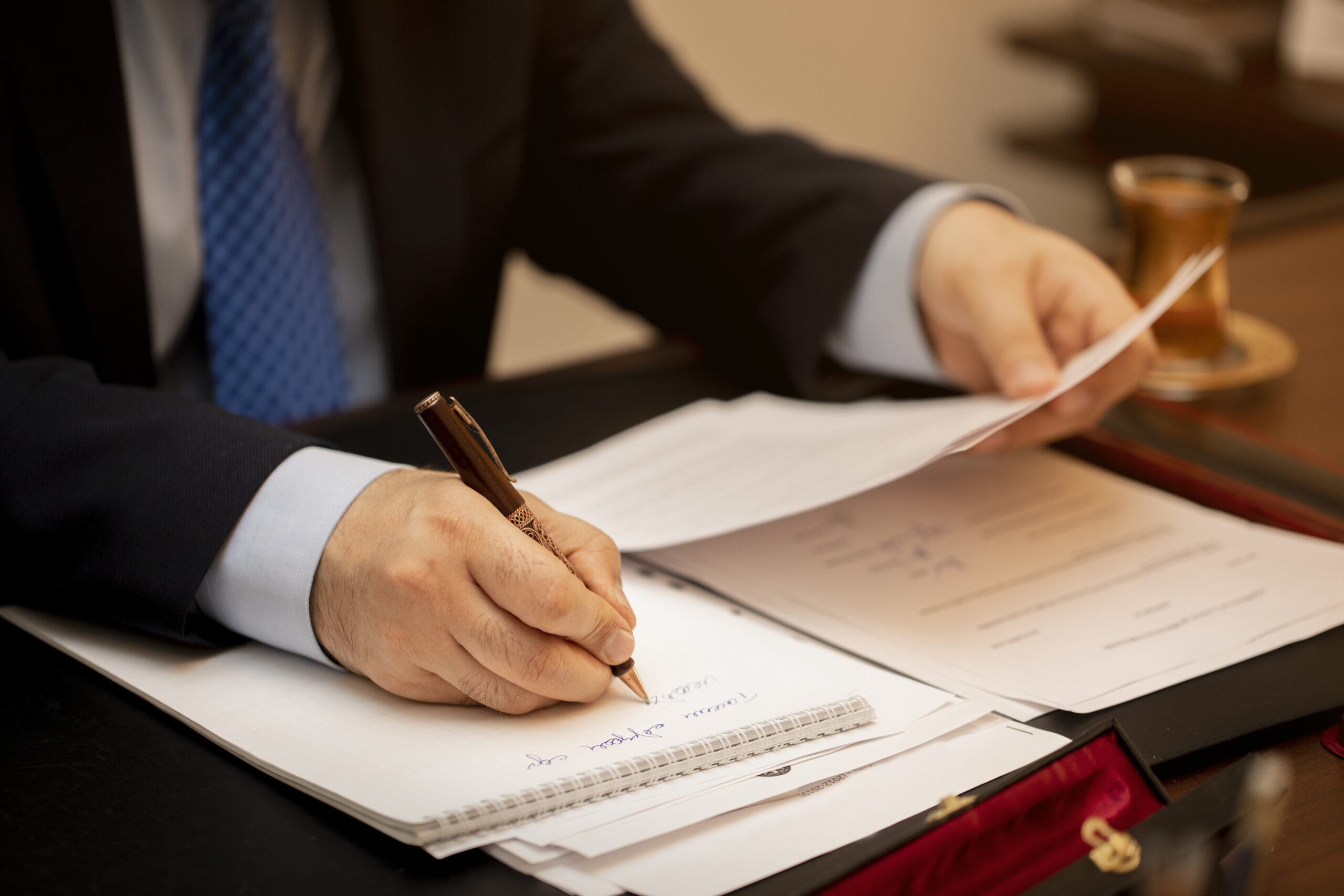 a man signing important legal document