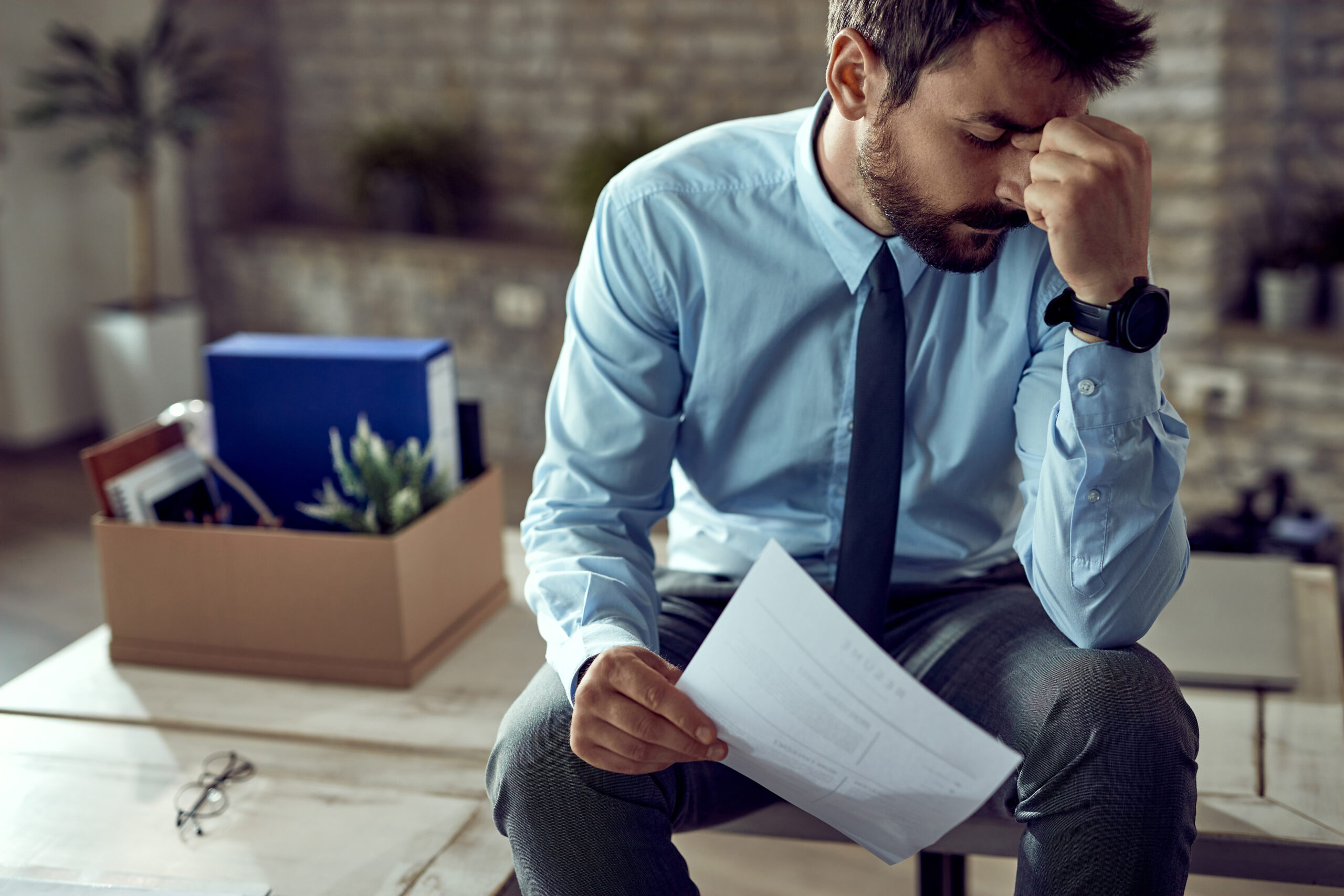unhappy San Diego landlord sitting in an office